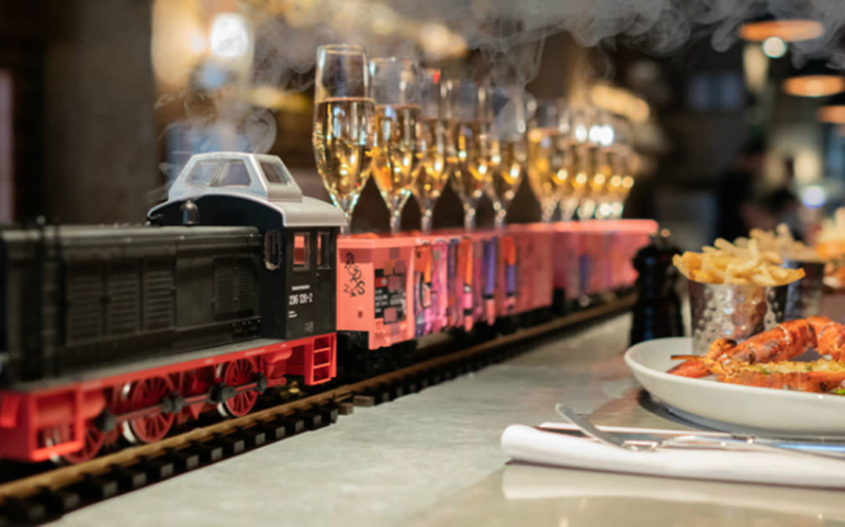 This Restaurant Is Serving Up Bottomless Champagne Delivered by Model Train